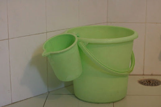 Water buckets in bathrooms